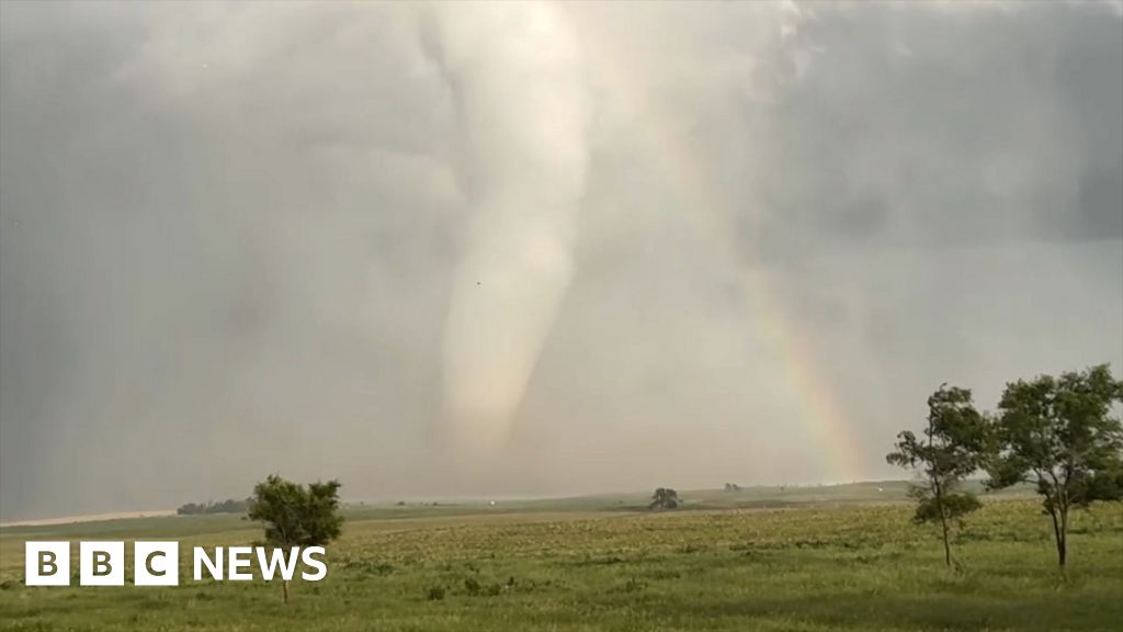 ‘Spectacular’ moment an enormous tornado crosses a rainbow