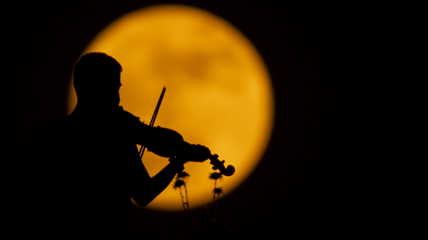 See the dazzling pictures of June’s Strawberry Moon : The Picture Show : NPR